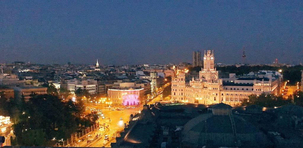 The city of Madrid fully alive at night.
